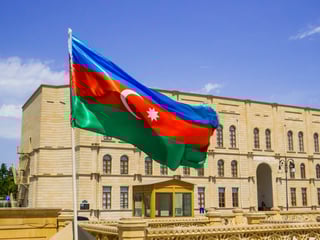 Azerbaijani flag in front of Baku's Heydar Mosque