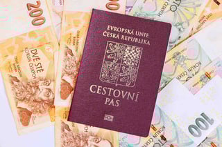 czech banknotes money of various czk koruna denomination swith czech passport